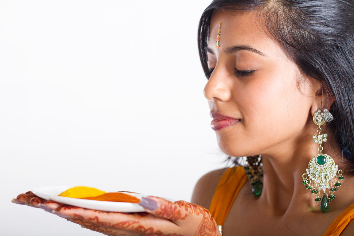 Indian woman with turmeric